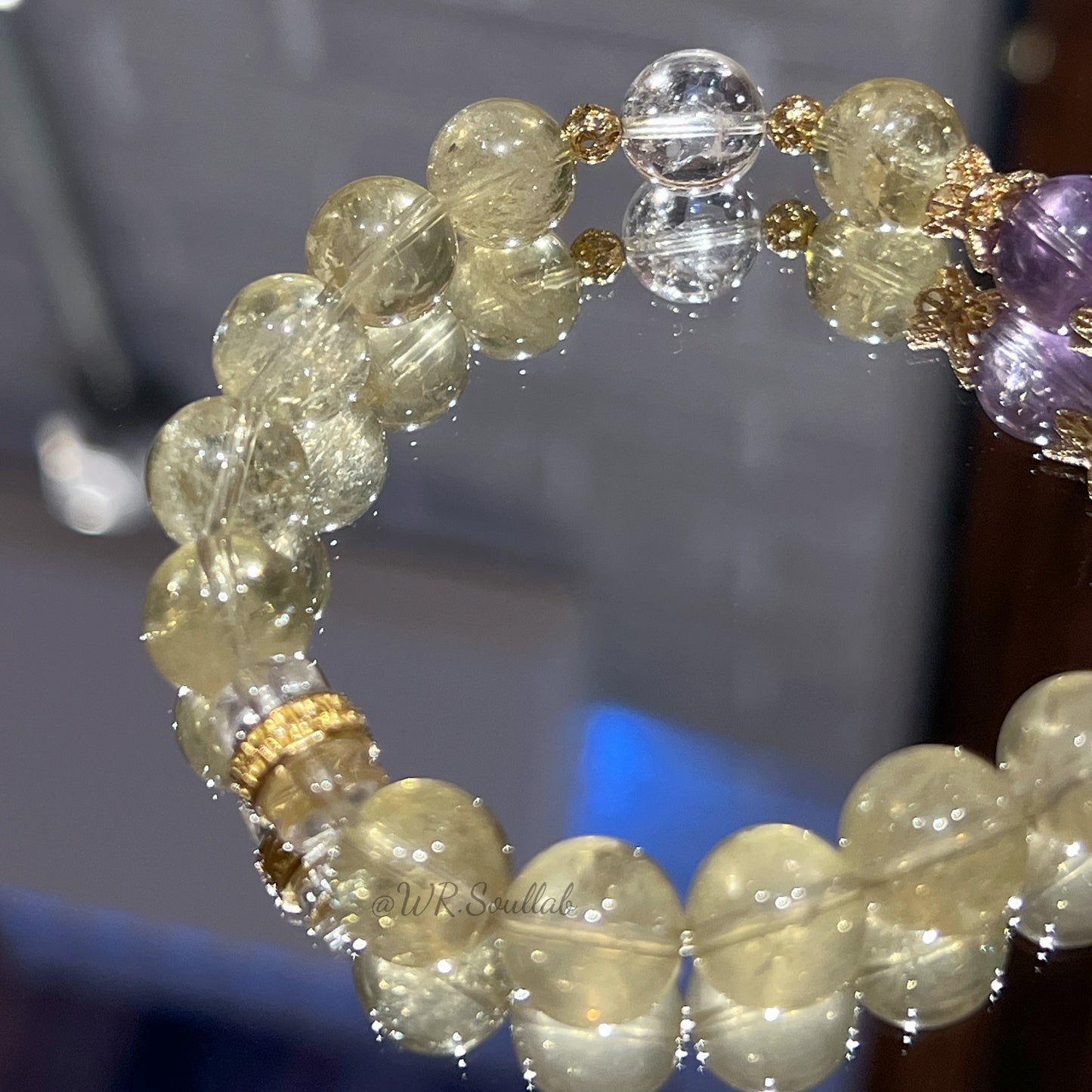 Huang Asai's crystal bracelet with a design to attract wealth